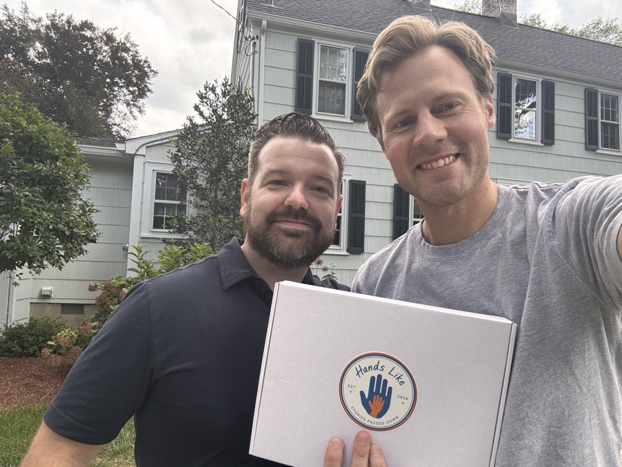 A copy of Hands Like Daddy's arriving at home