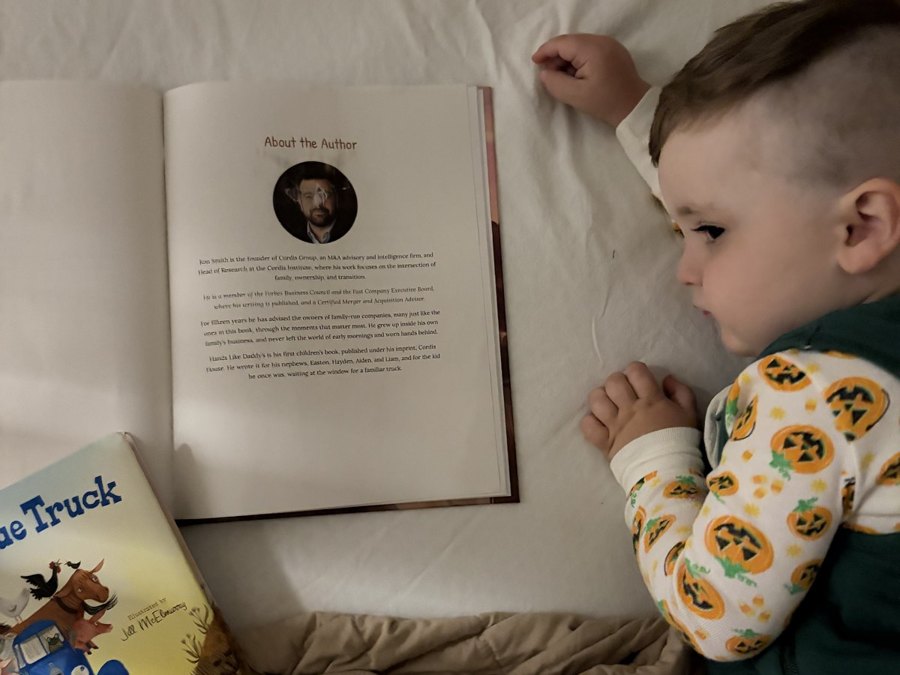 Hayden pointing at the author photo in the back of the book