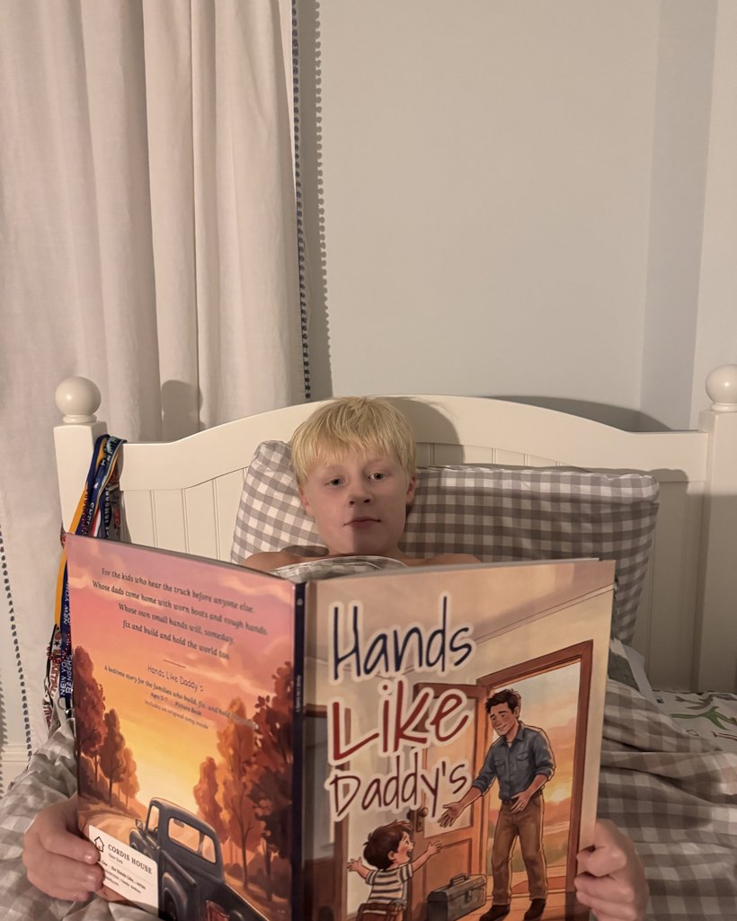 Victor's son reading in bed